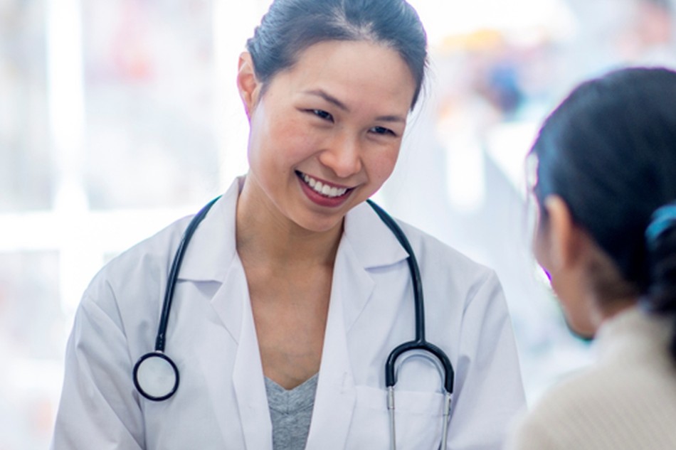 A doctor talking with a patient in a consulting room